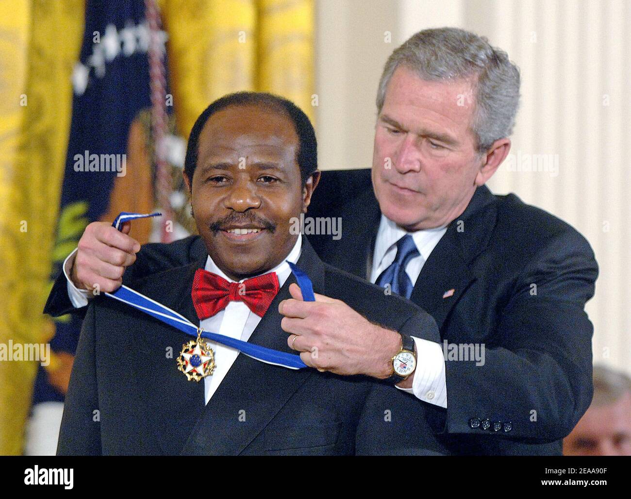 U.S President George W. Bush honors celebrities and personalities including Paul Rusesabagina, who sheltered people at a hotel he managed during the 1994 Rwandan genocide with the Presidential Medal of Freedom during a ceremony at the White House in the East room in Washington, D.C. on November 9, 2005. Photo by Olivier Douliery/ABACAPRESS.COM Stock Photo