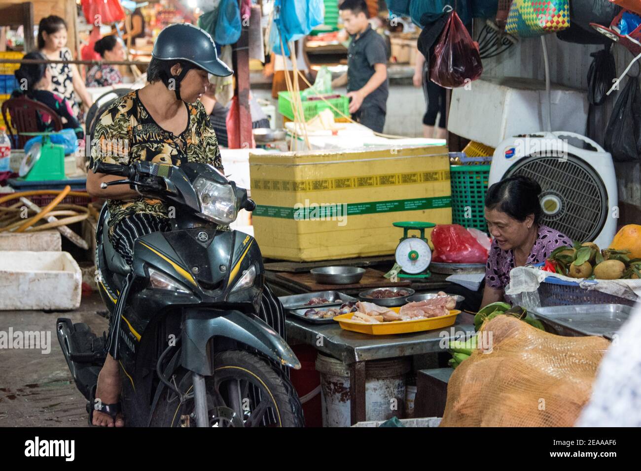 Weekly market, shopping with moped Stock Photo