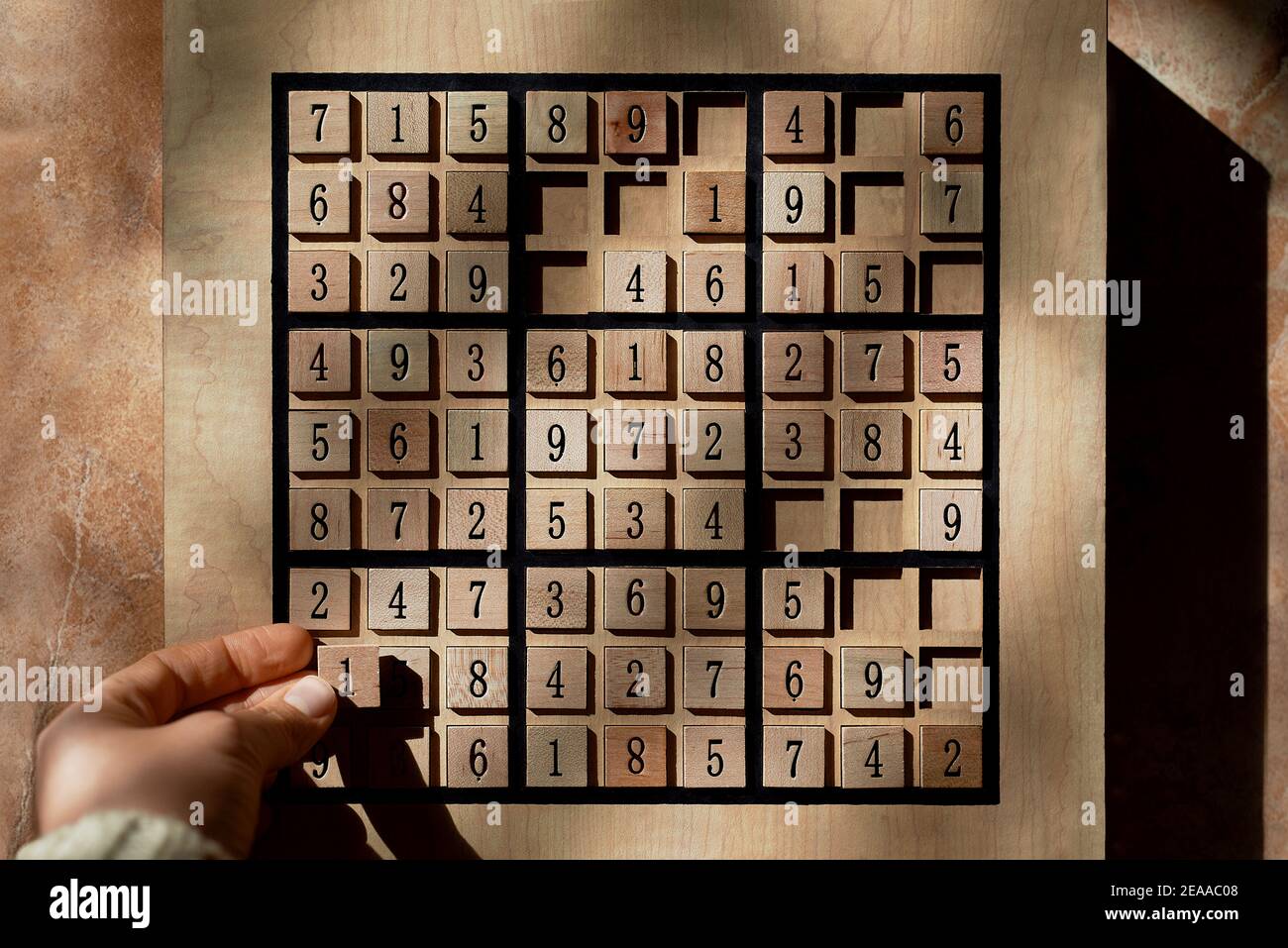 Playing on Sudoku game board with puzzle stock photo Stock Photo