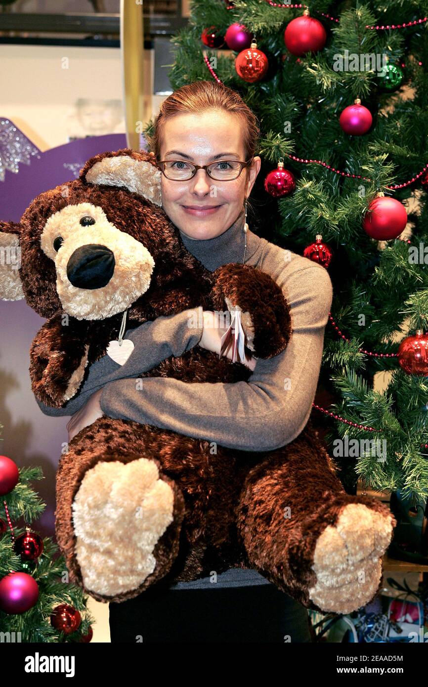 french-actress-carole-bouquet-poses-during-an-event-to-present-a-stuffed-bear-wich-will-be-sold-as-a-christmas-gift-for-the-benefit-of-the-association-la-voix-de-lenfant-at-the-bhv-department-store-in-paris-france-on-november-24-2005-carole-bouquet-is-the-patron-of-la-voix-de-lenfant-to-help-ill-treated-children-photo-by-laurent-zabulonabacapresscom-2EAAD5M.jpg
