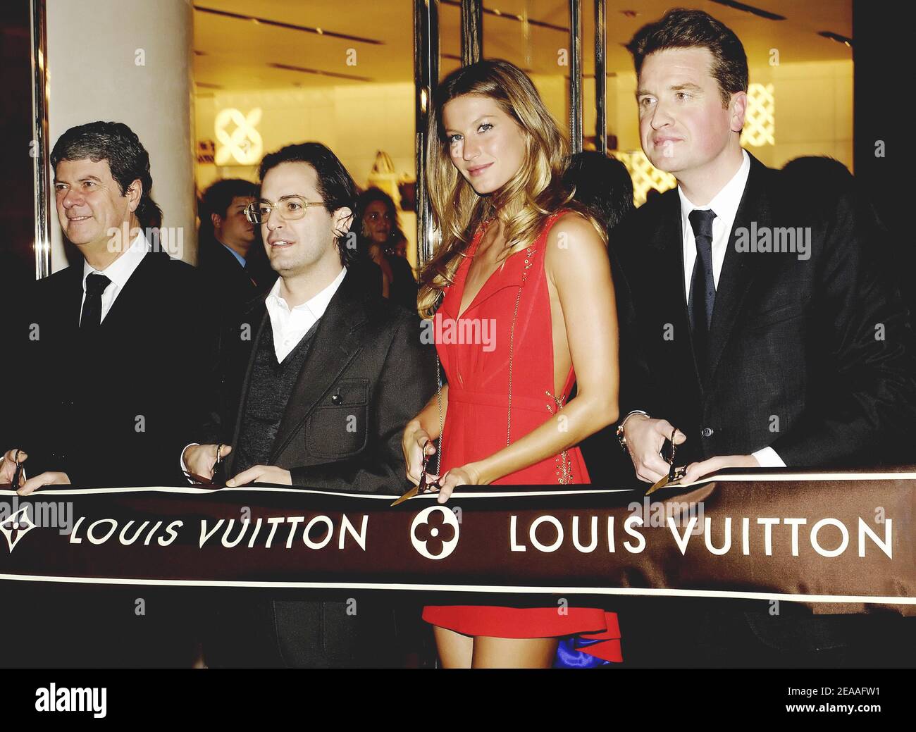 Yves Carcelle, left, Chairman and CEO of Louis Vuitton, poses with  Taiwanese model Patina Lin during the opening ceremony of a Louis Vuitton  store in Stock Photo - Alamy