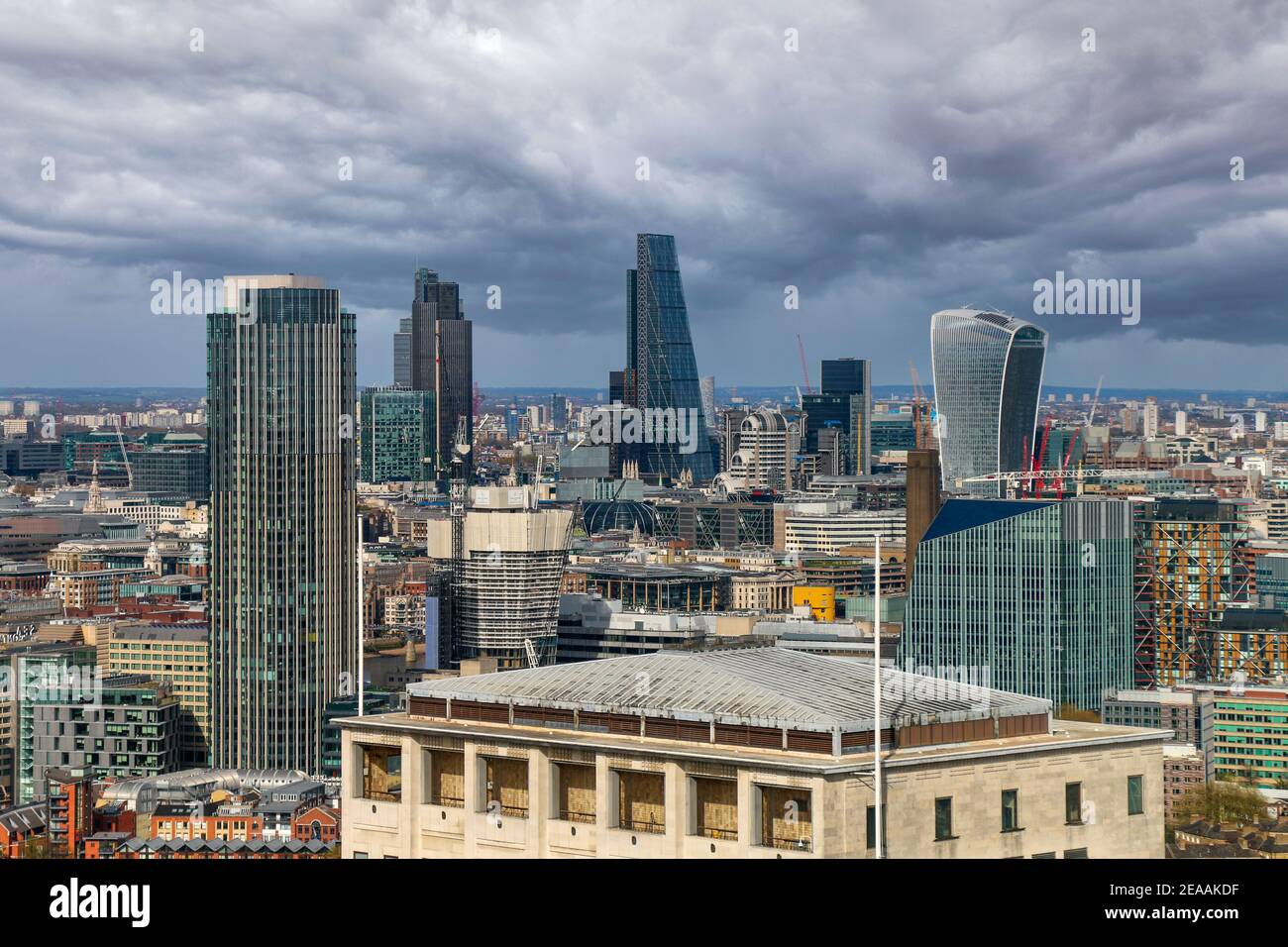 London downtown view with shard and other skyscraper on sunny day with dramatic clouds, London 