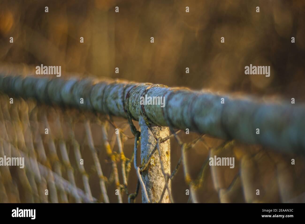 rusty railing with wire fence Stock Photo - Alamy
