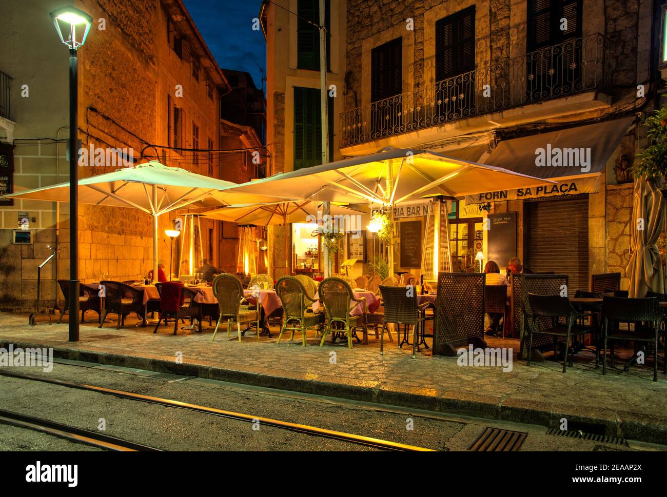 Illuminated street restaurant, Sóller Stock Photo