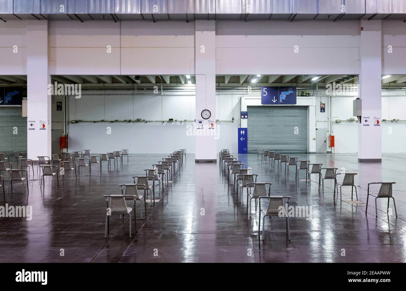 Essen, Ruhr area, North Rhine-Westphalia, Germany - Corona vaccination center Essen in the halls of Messe Essen, here more than 2, 000 people are to be vaccinated per day, chairs are by far available in the waiting area. Stock Photo