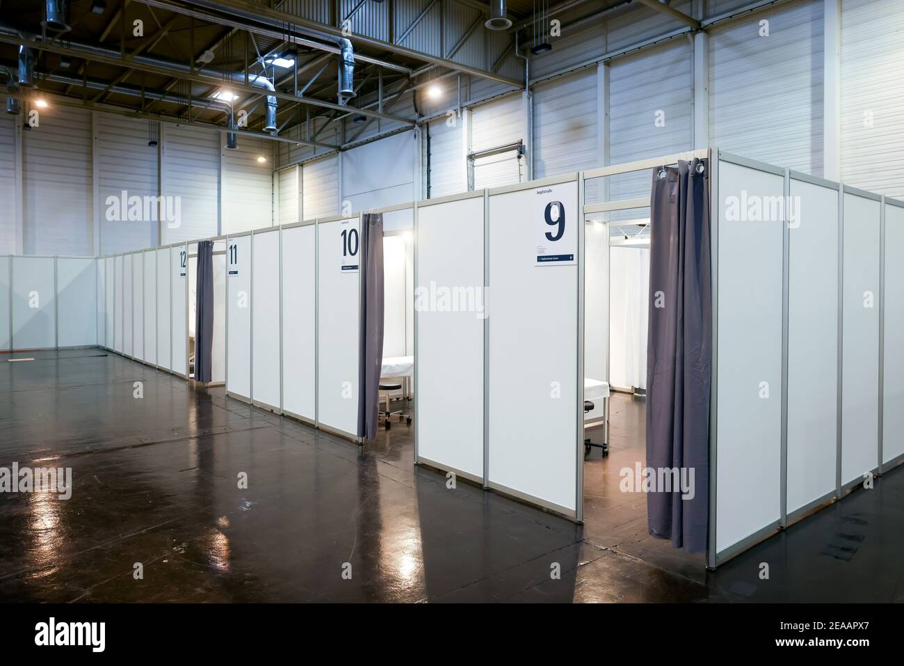 Essen, Ruhr area, North Rhine-Westphalia, Germany - Corona vaccination center Essen in the halls of Messe Essen, in the vaccination booths of the vaccination routes, more than 2, 000 people are to be vaccinated per day. Stock Photo