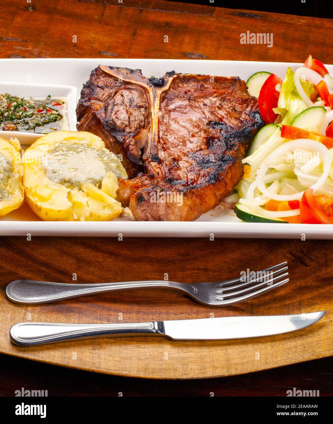 T bone steak with potato and salad Stock Photo - Alamy