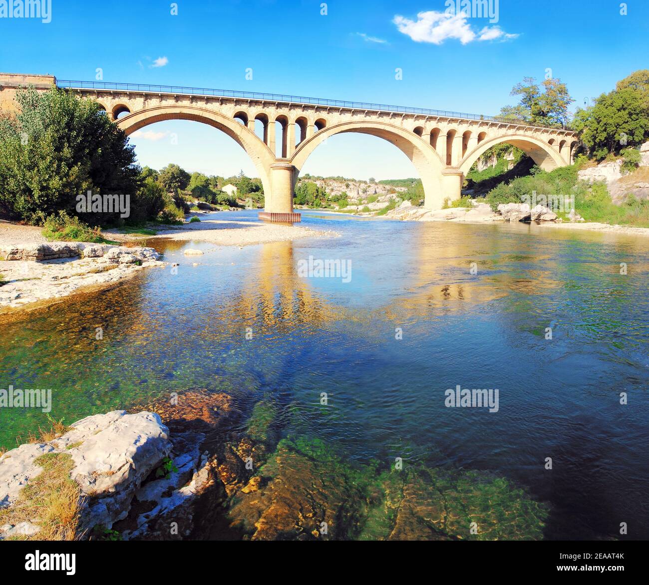 Architecture of the Collias bridge on the Gard river in Occitanie France. Stock Photo