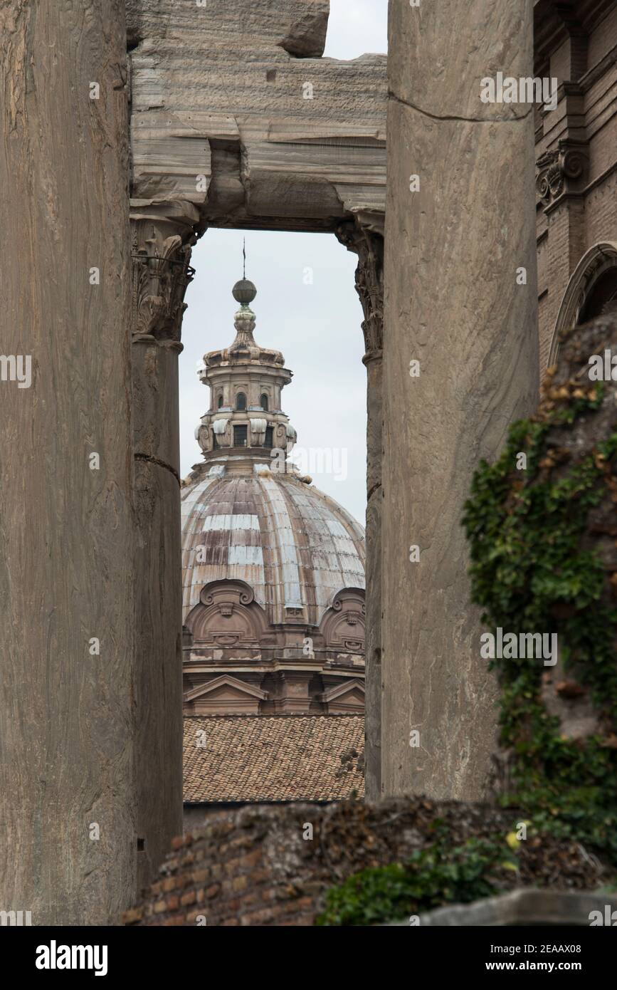 Church tower between roman columns, Rome Stock Photo