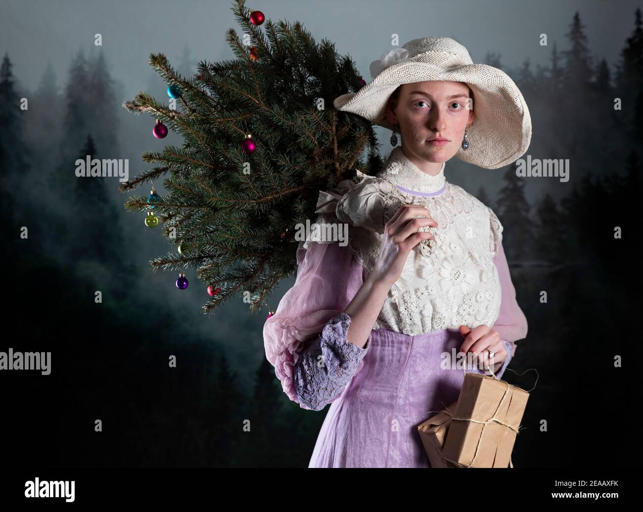 Woman with Christmas Tree, Pink Vintage Dress Stock Photo