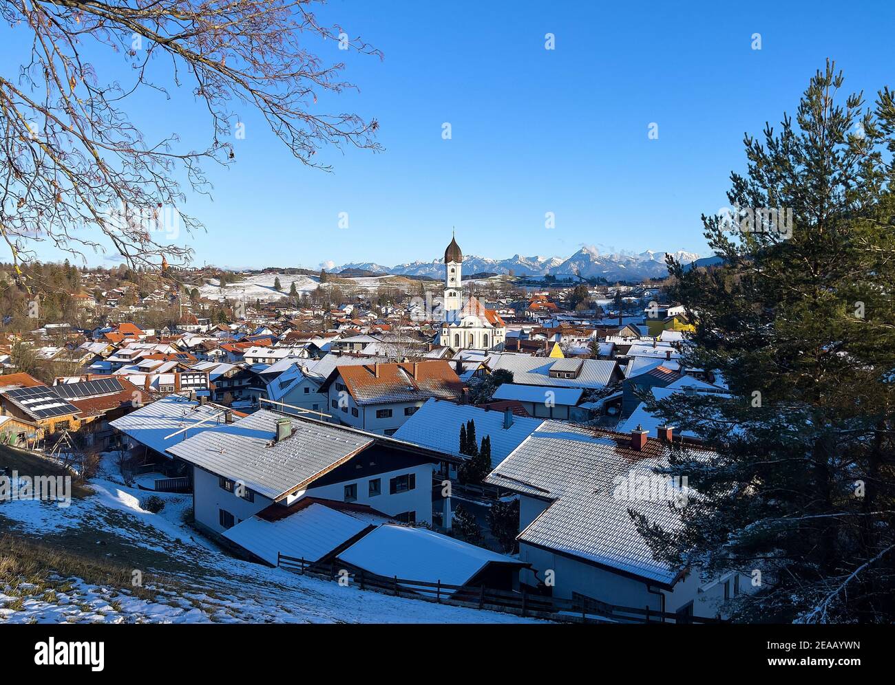 Panoramic landscape view of the village Nesselwang with St.Andreas church, Bavaria, Germany, February 8, 2021.  © Peter Schatz / Alamy Live News Stock Photo