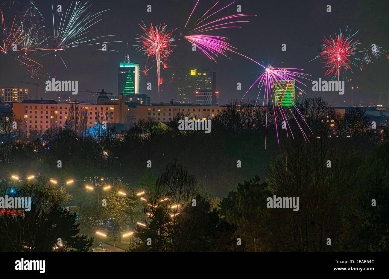 Fireworks at the illuminated city of Munich at night. Stock Photo