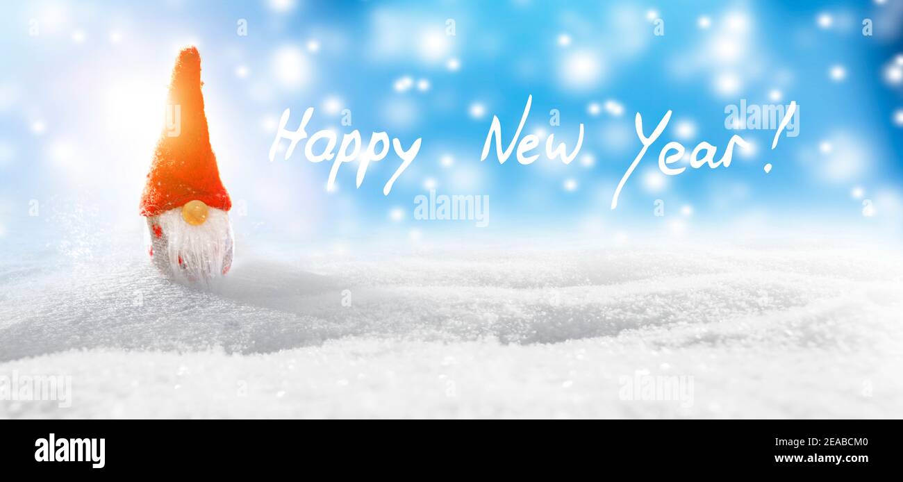 Little Santa Claus wishes a Happy New Year 2021 Stock Photo