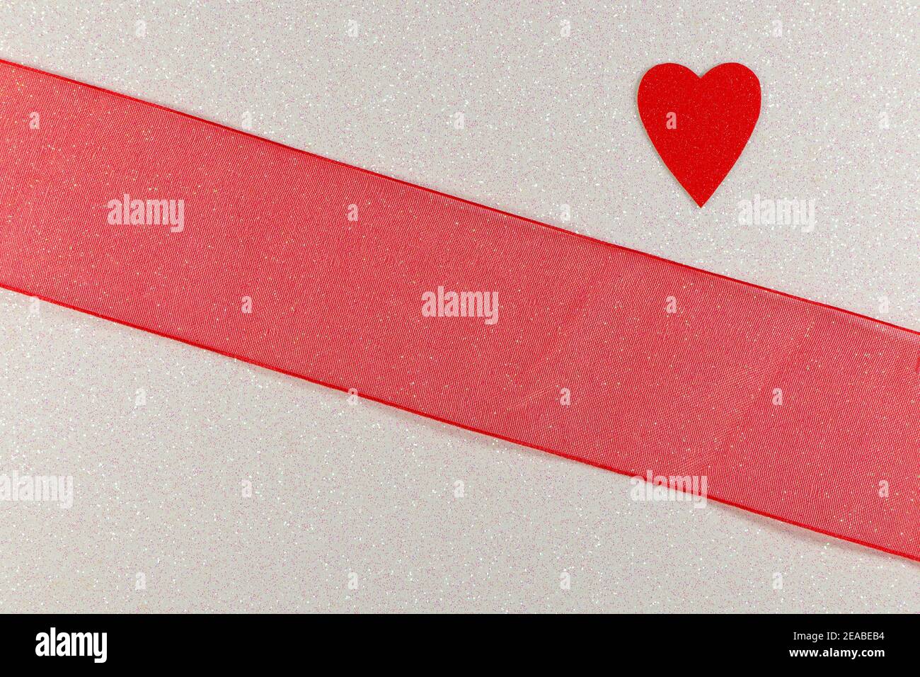 Red Heart And Red Ribbon Design On Textured White Stock Photo