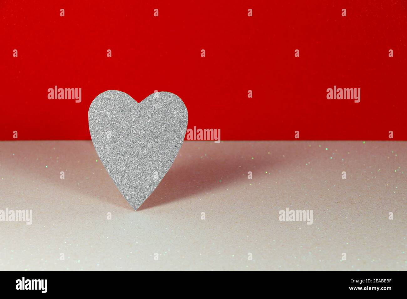 Silver Heart On White With Red Background Stock Photo - Alamy