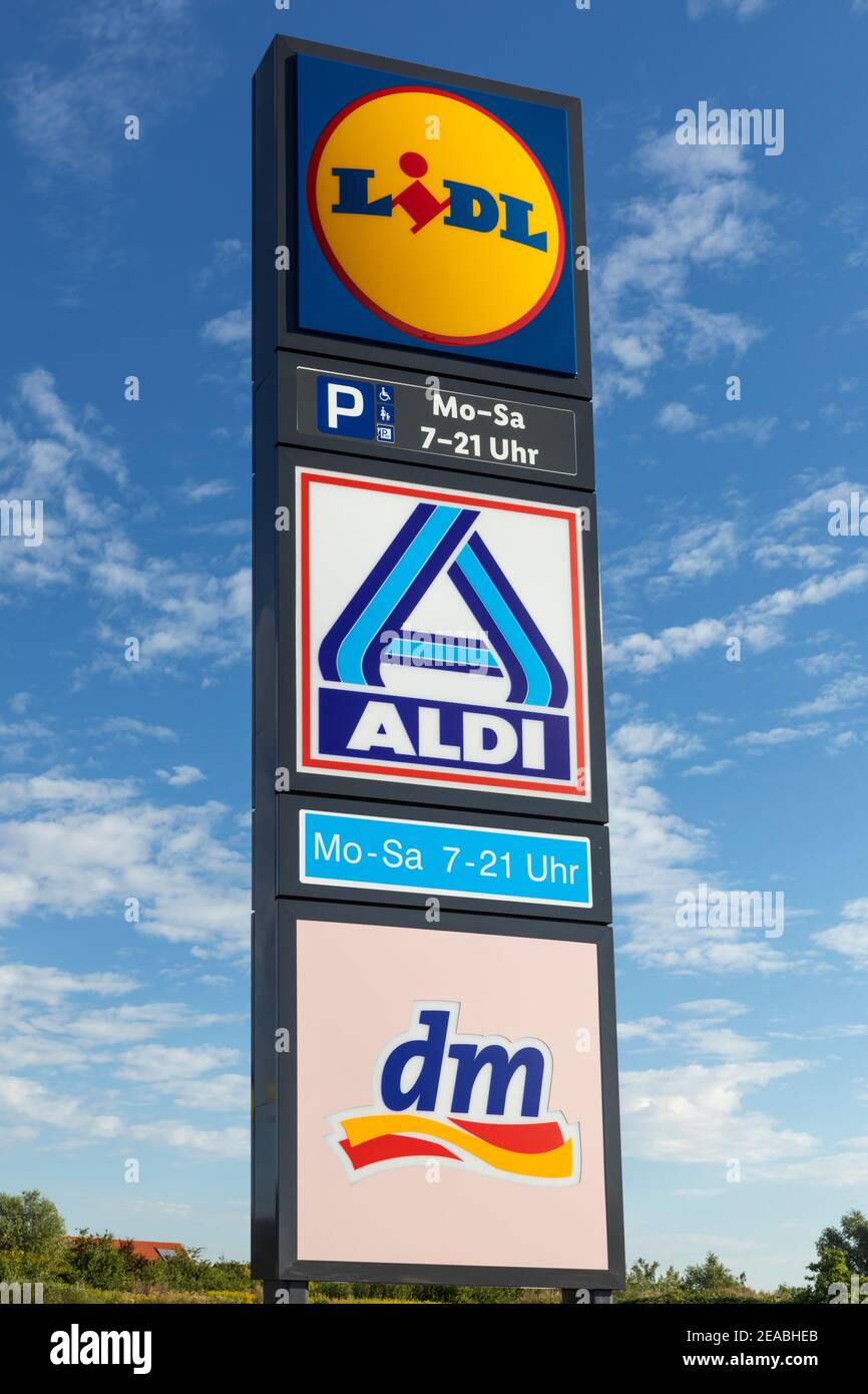 Lidl logo, Aldi logo and dm logo on the shared parking lot of the branches in Wilhelmshaven, Lower Saxony, Stock Photo