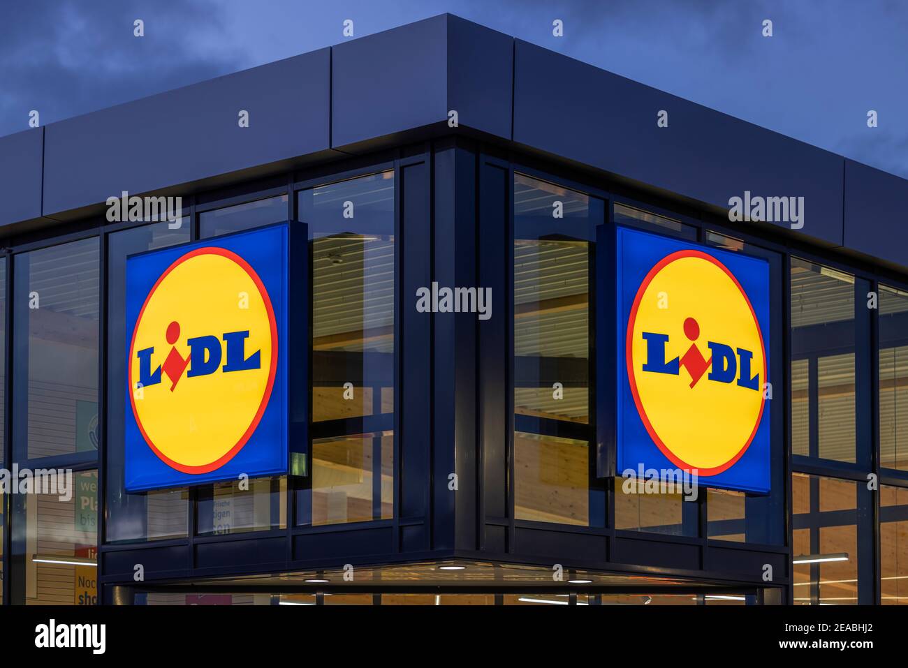 Illuminated Lidl logo on the building of a Lidl branch in Wilhelmshaven, Lower Saxony, Stock Photo