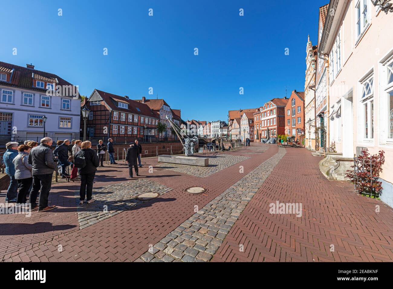 Group of visitors, city tour, half-timbered houses, row of houses, gabled houses, street 'Wasser West', at the old Hansehafen, Schwinge river, Stade, Lower Saxony, Stock Photo