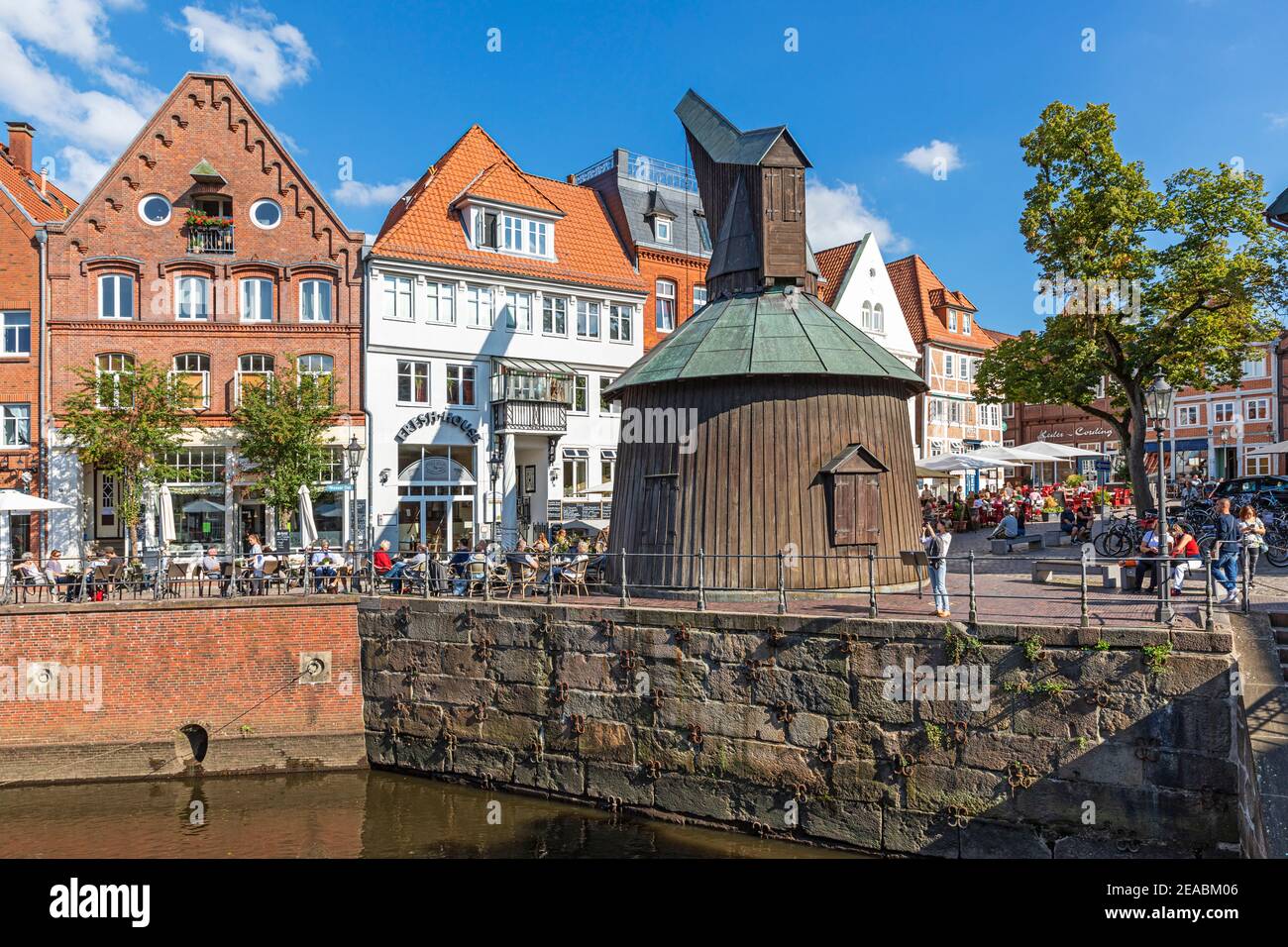 Wooden treading crane, half-timbered houses, fish market, at the old Hansehafen, Schwinge river, Stade, Lower Saxony, Stock Photo