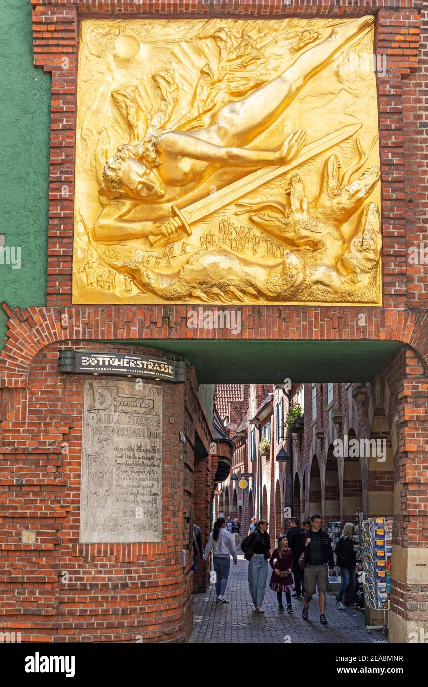 Facade relief, 'The Light Bringer' by Bernhard Hoetger, above the entrance to Böttcherstraße, Bremen, Stock Photo