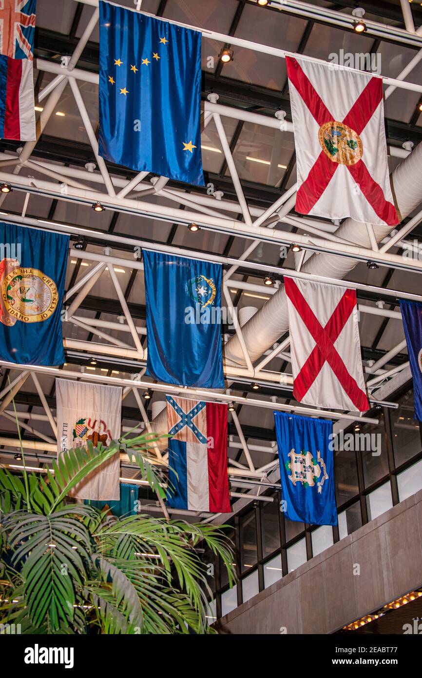 State flags han g above the lobby of Government Center Metrorail Station in downtown Miami, Florida. Stock Photo