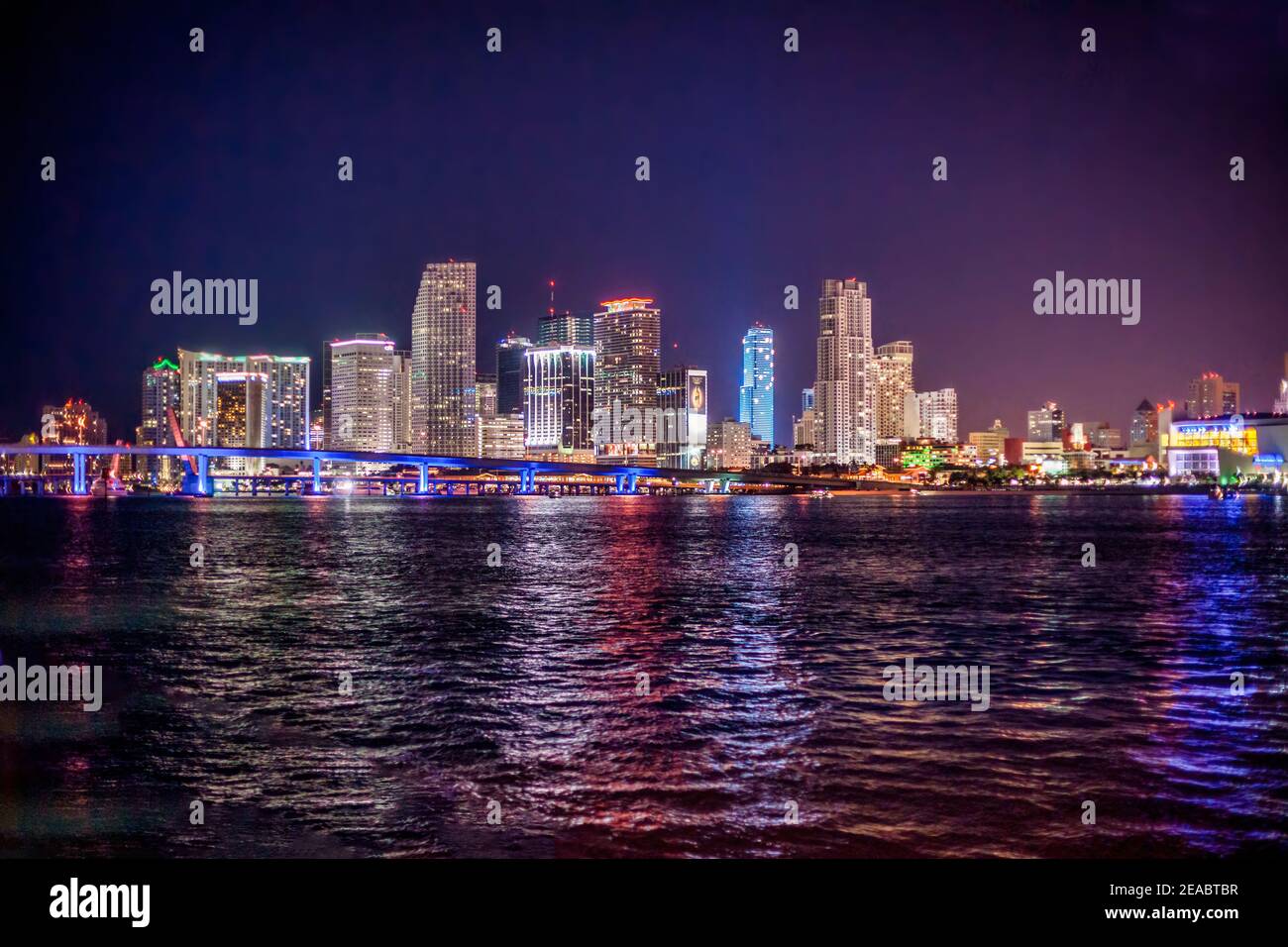 The nighttime Miami skyline seen from Watson Island on the MacArthur Causeway. Stock Photo