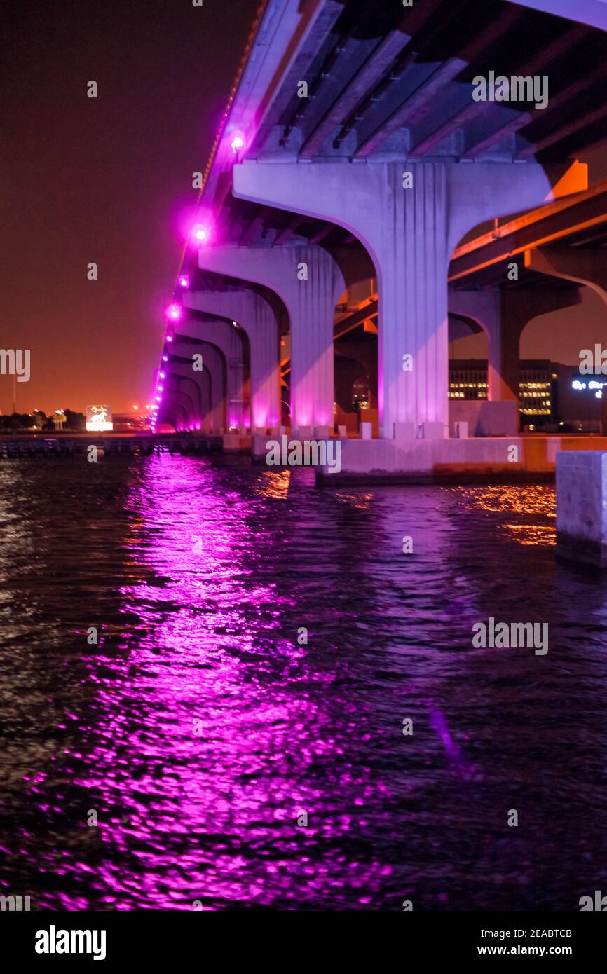 The substructure of the MacArthur Causeway Bridge lite at night with