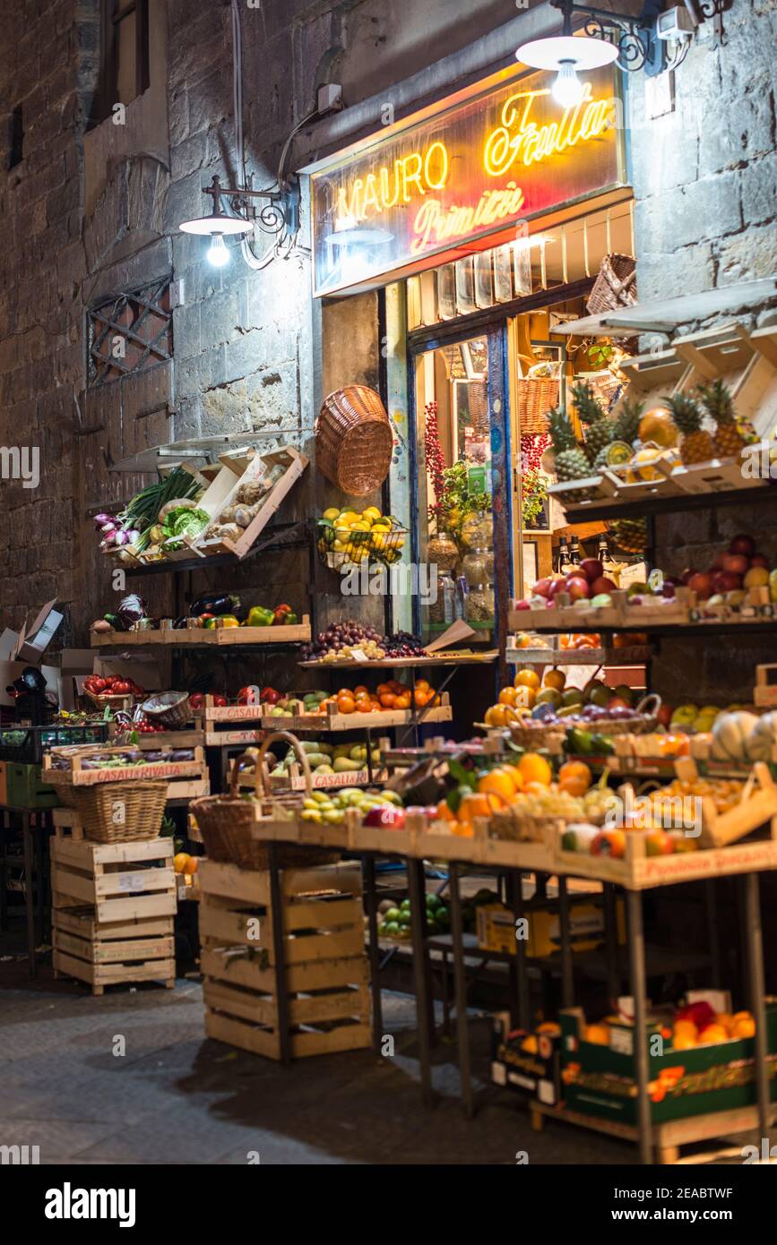 Illuminated vegetable and fruit shop Stock Photo