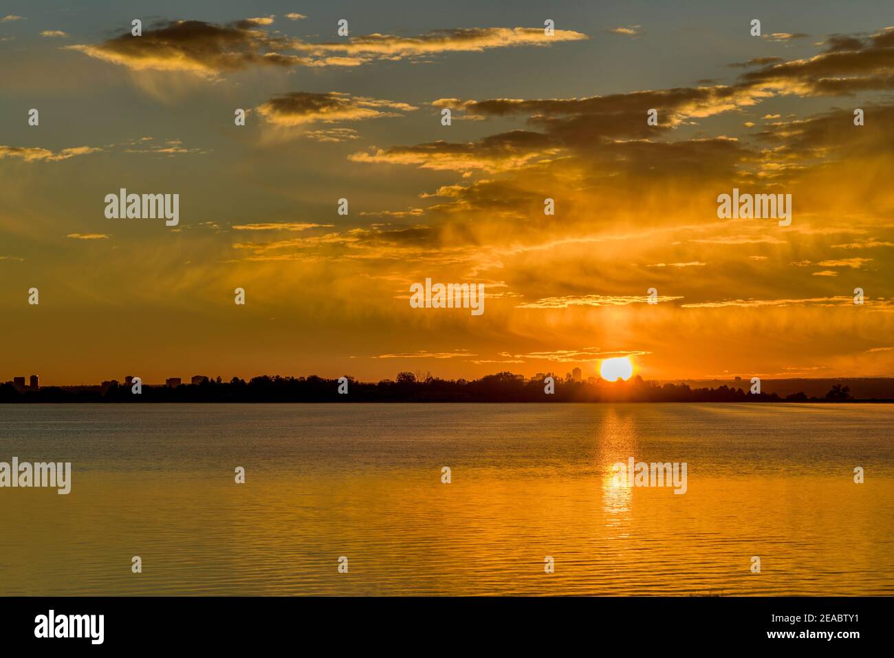 Sunrise at City Lake - A colorful autumn sunrise at Marston Lake, Denver, Colorado, USA. Stock Photo