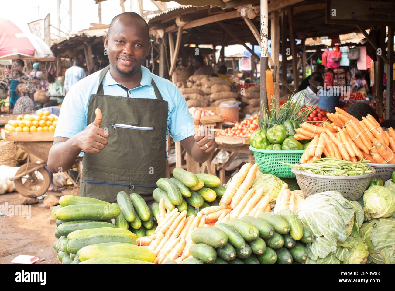 an african man in the market give a thumbs up Stock Photo Alamy