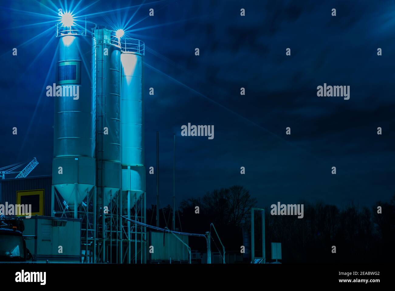 Concrete mixing plant with cement silos at night Stock Photo Alamy