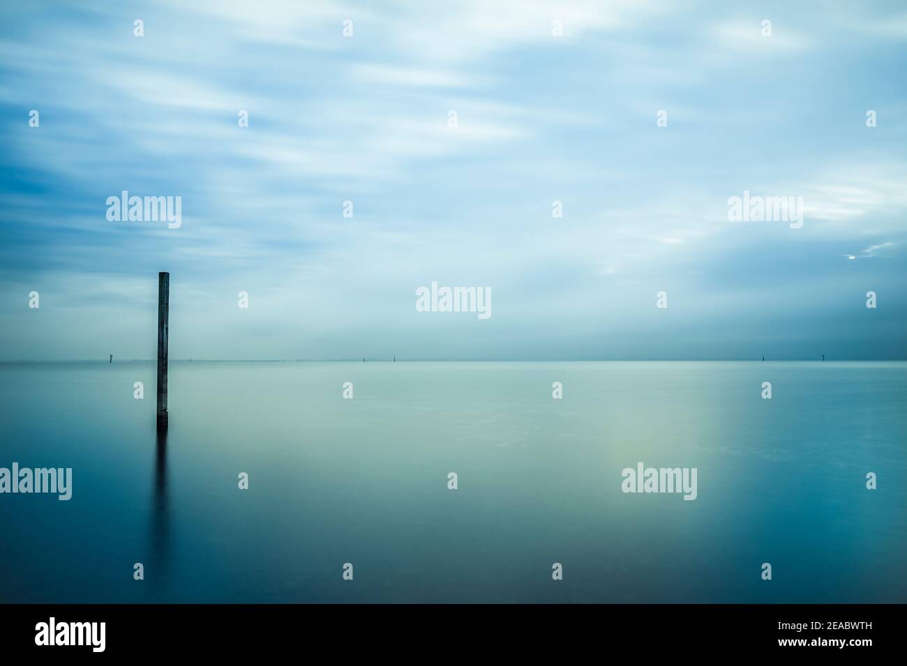 Horizon over water with blurred water surface Stock Photo