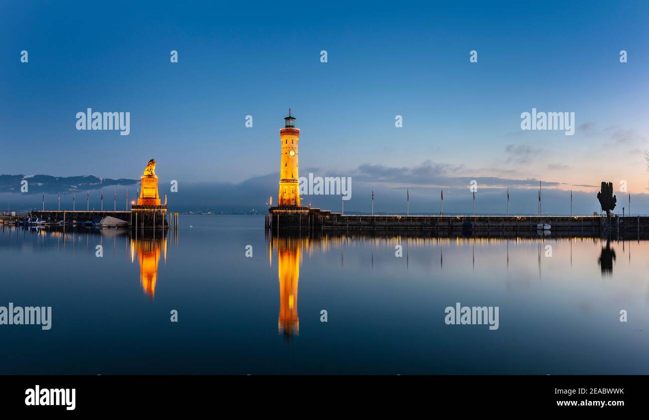 Port entrance of Lindau am Bodensee in the evening in winter Stock Photo