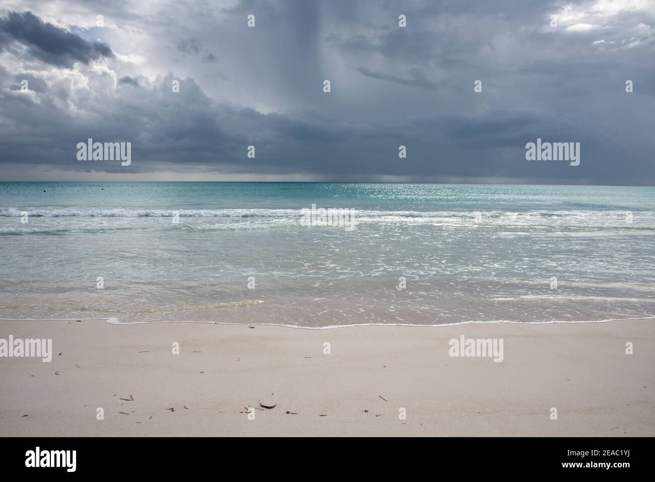 Sandy beach with thunderstorm Stock Photo