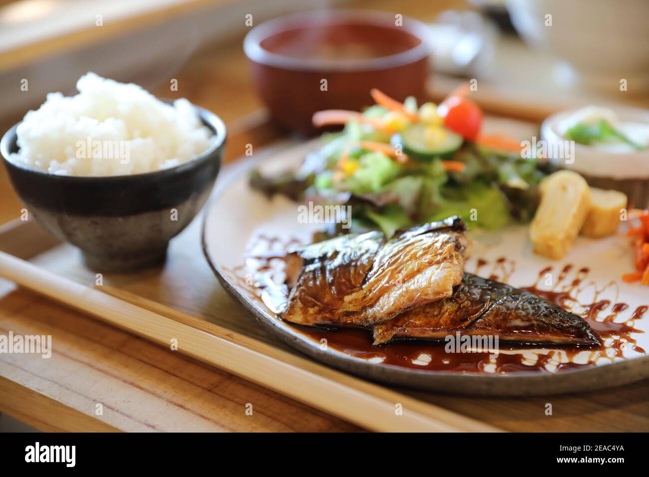 Saba fish teriyaki with rice soup and salad on wood background , Japanese food Stock Photo