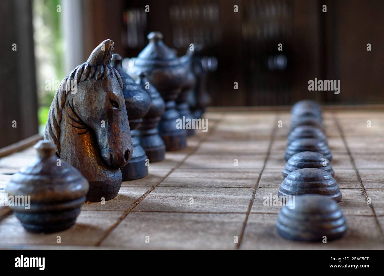 Chess pieces in starting position on a wooden Board Stock Photo by  ©Rostislavv 141334490