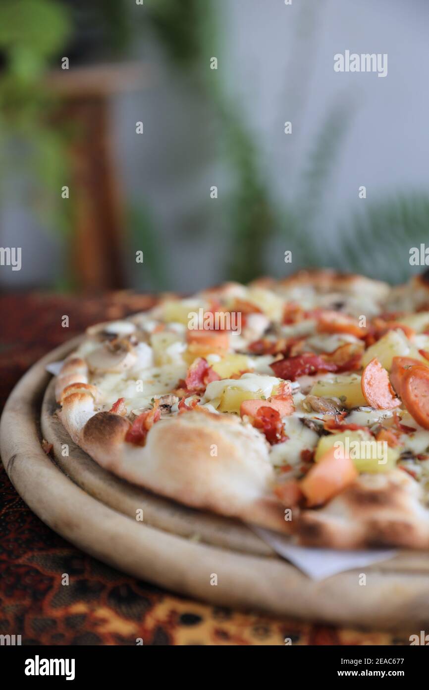 Pizza sausage bacon and pineapple on wooden , pizza hawaiian Stock Photo Alamy