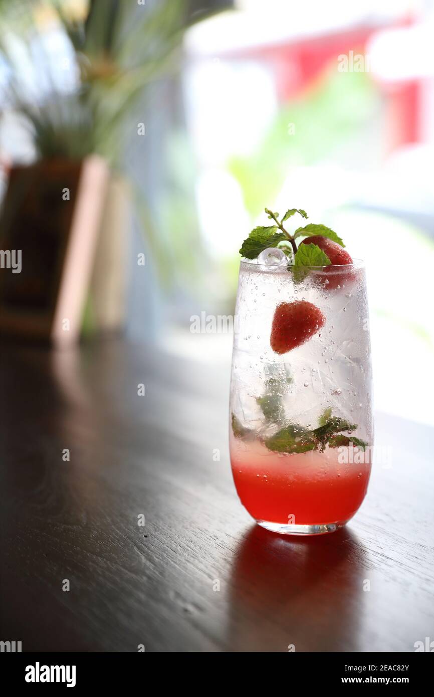 Strawberry mojito cocktail drink on wood background Stock Photo