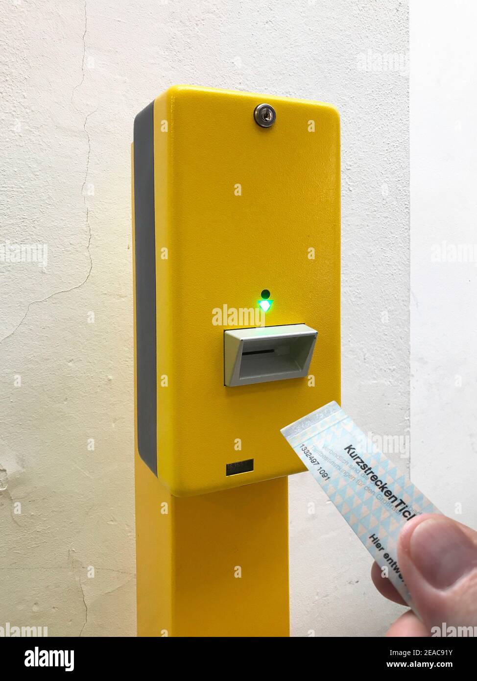 Ticket validation stamping machine at a train station Stock Photo