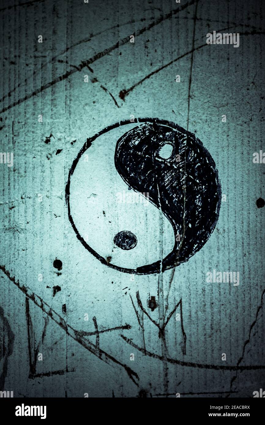 Yin and Yang signs on a concrete wall Stock Photo