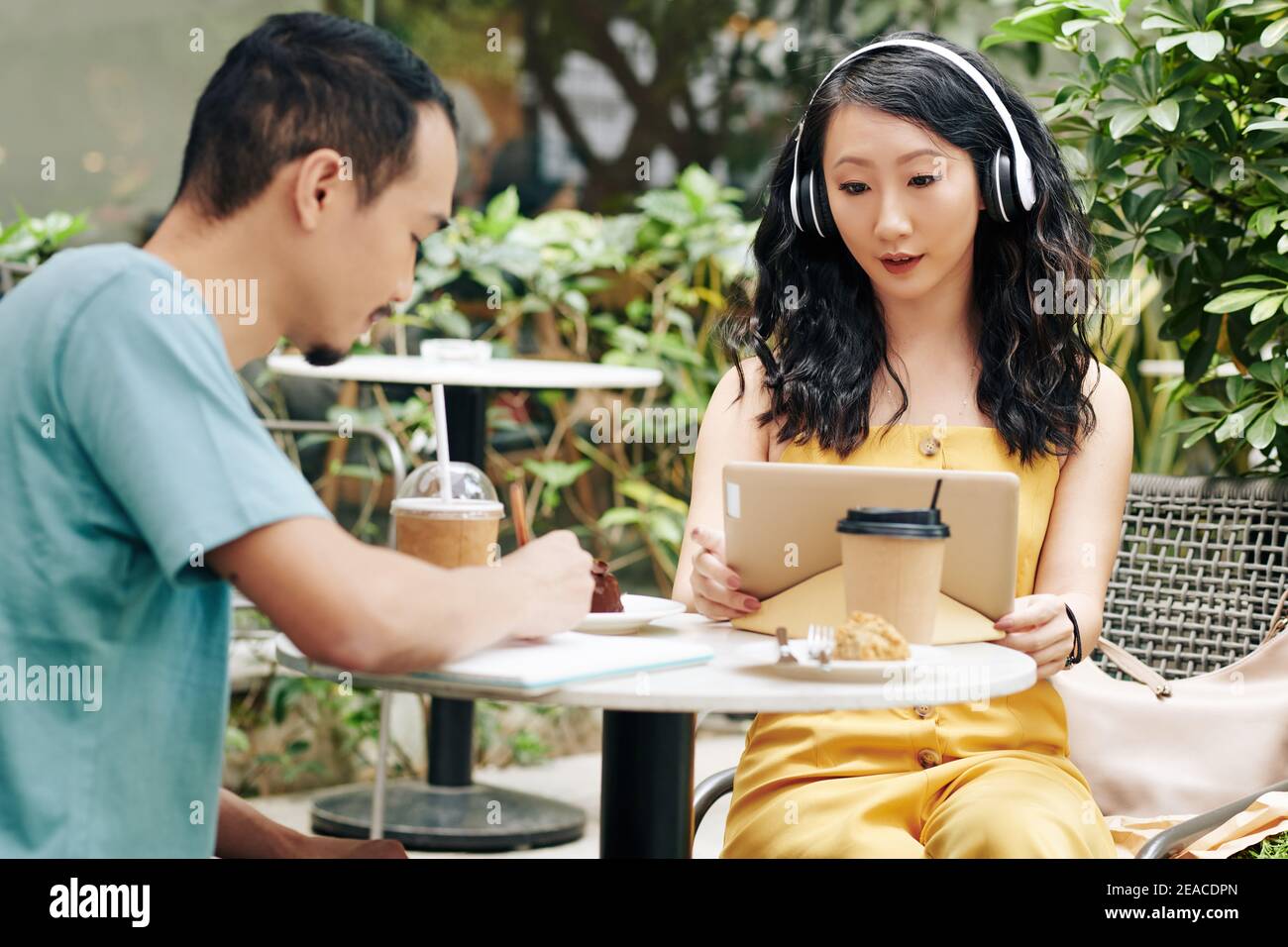 Couple studying in cafe Stock Photo