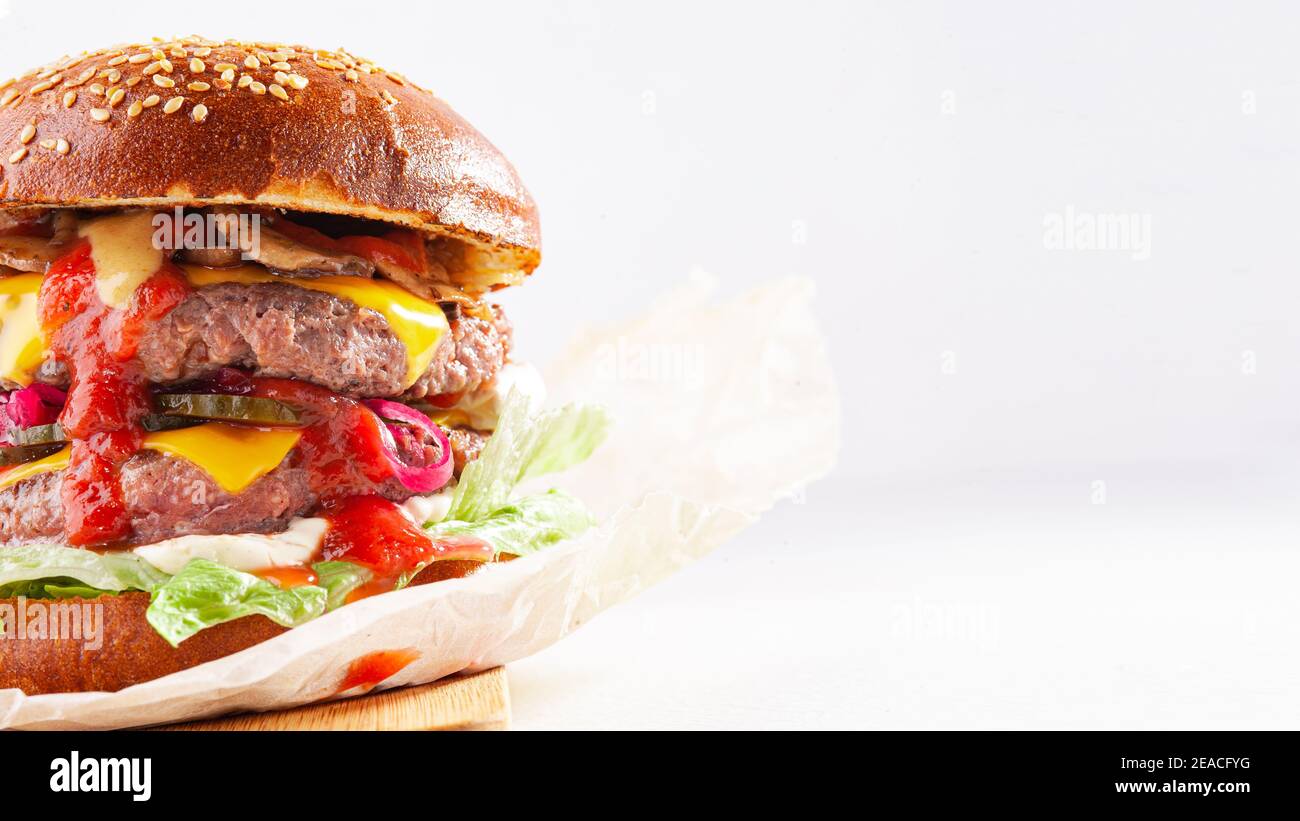 Delicious fresh burger on the white background Stock Photo