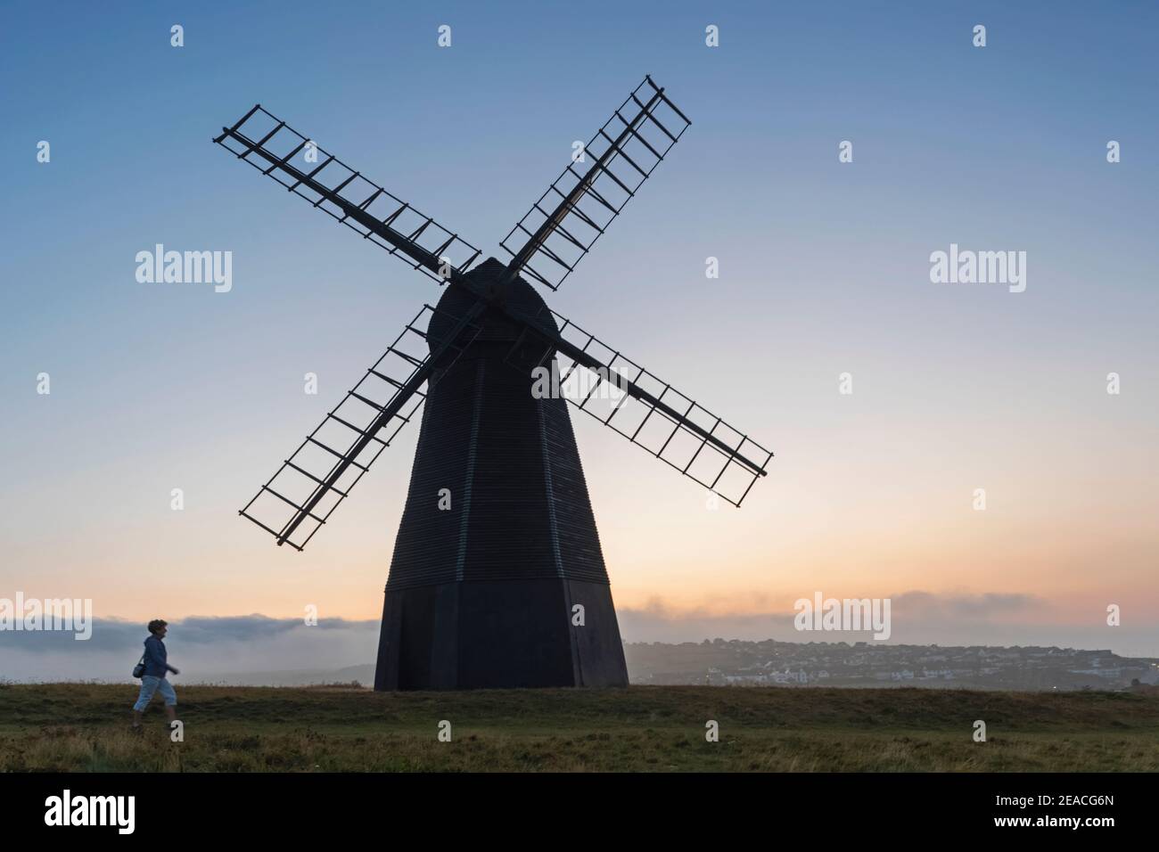England, West Sussex, Brighton, Rottingdean, Silhouette of Rottingdean Windmill on Beacon Hill at Dawn Stock Photo