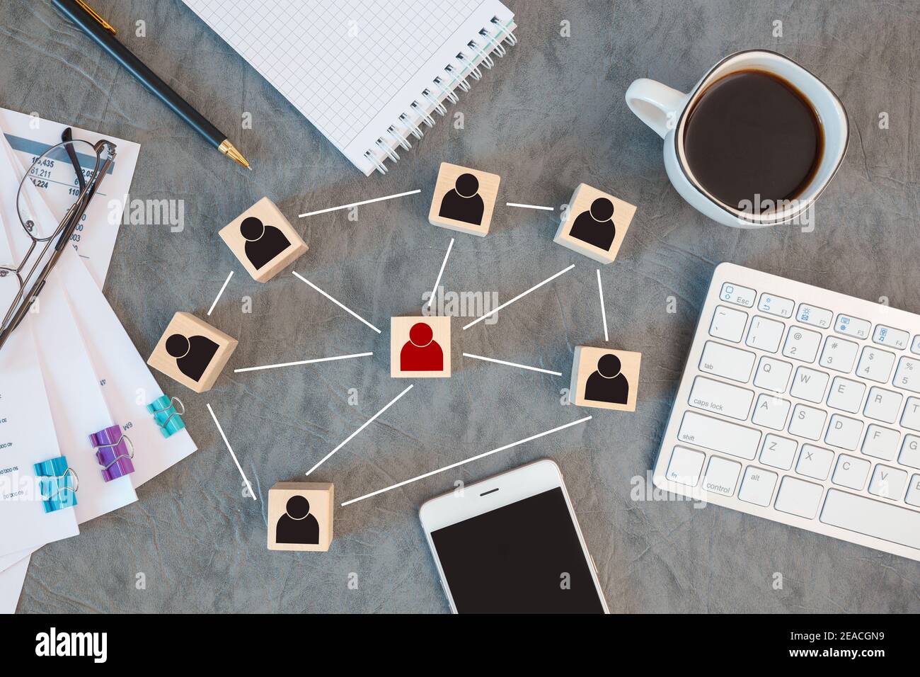 Organization structure, team building, recruitment, management and human resources concepts. Person icons on wooden cubes linked to each other. Stock Photo