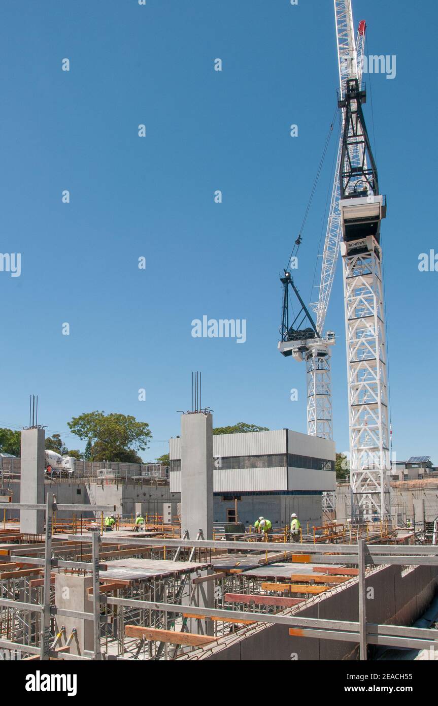 Large cranes working at the construction site for a 9-storey aged care and medical precinct development, South Caulfield, Melbourne, Australia Stock Photo
