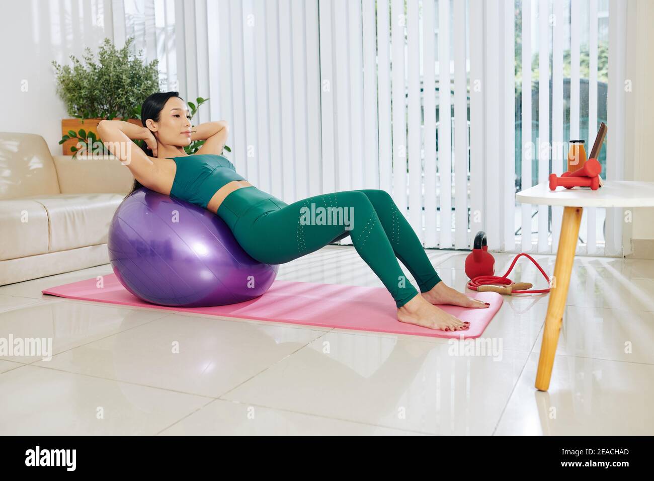 Fit woman doing abs exercise Stock Photo