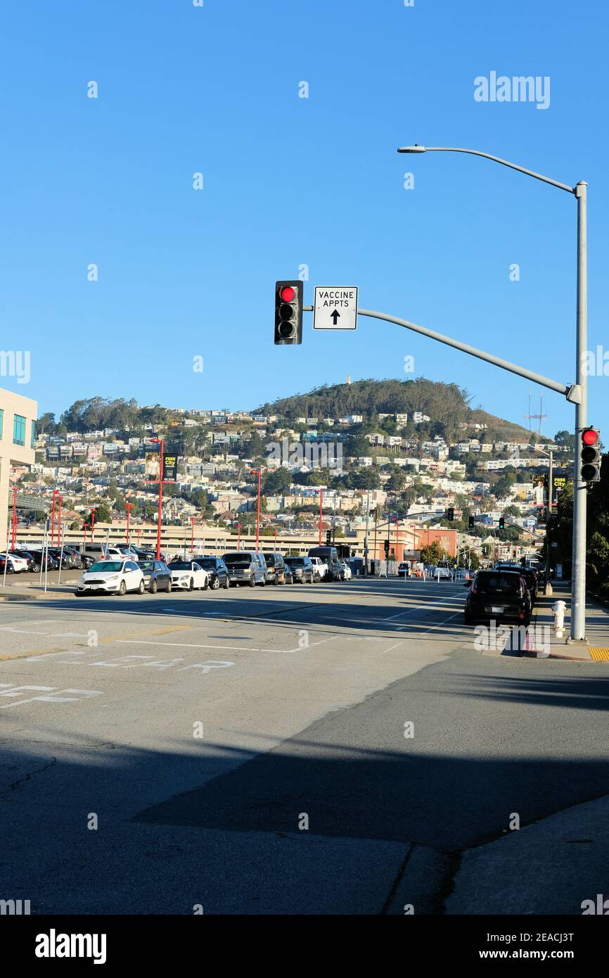 Traffic street sign directing patients to the Covid-19 vaccination site at City College of San Francisco, California; vaccine appointments only. Stock Photo