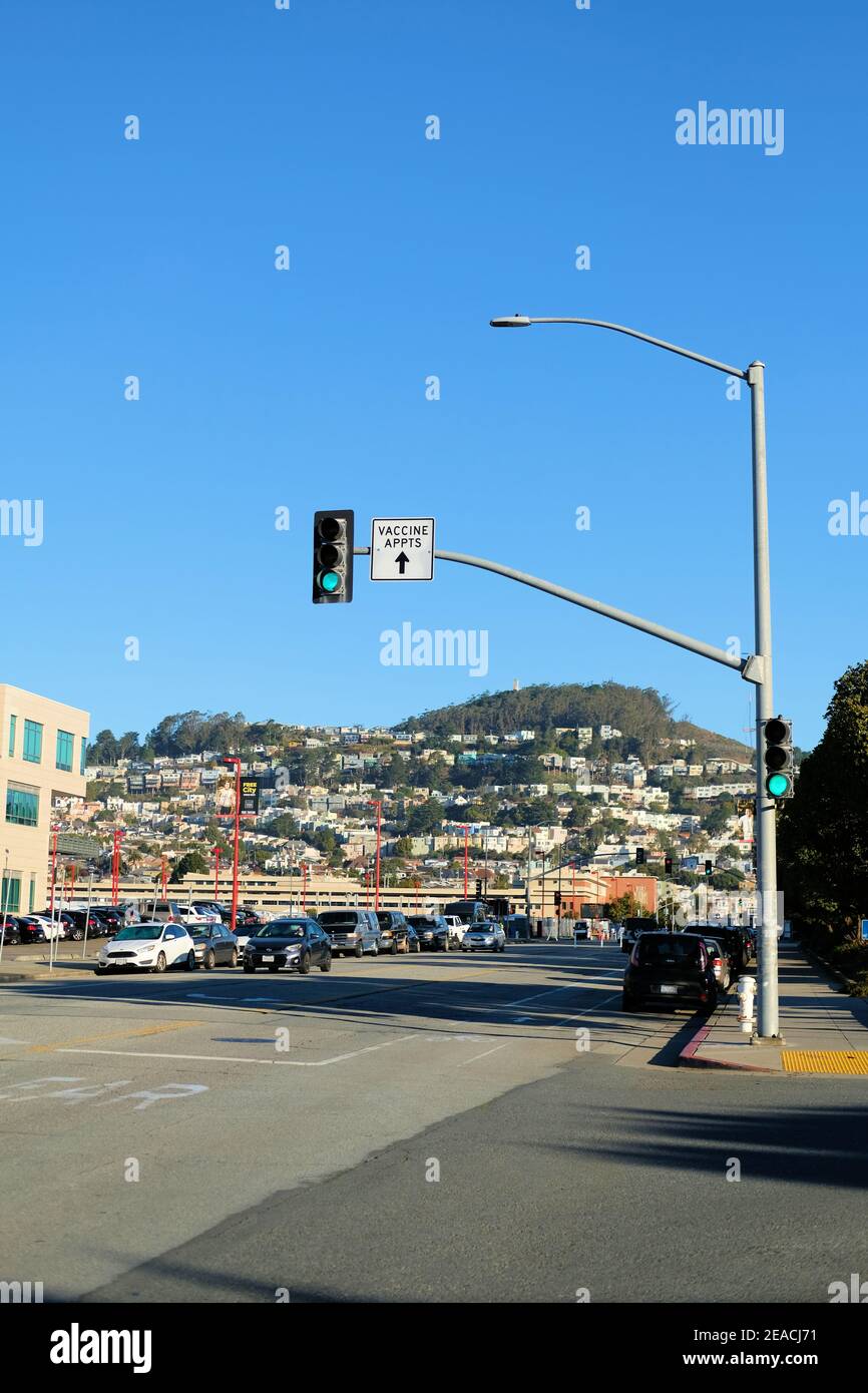 Traffic street sign directing patients to the Covid-19 vaccination site at City College of San Francisco, California; vaccine appointments only. Stock Photo