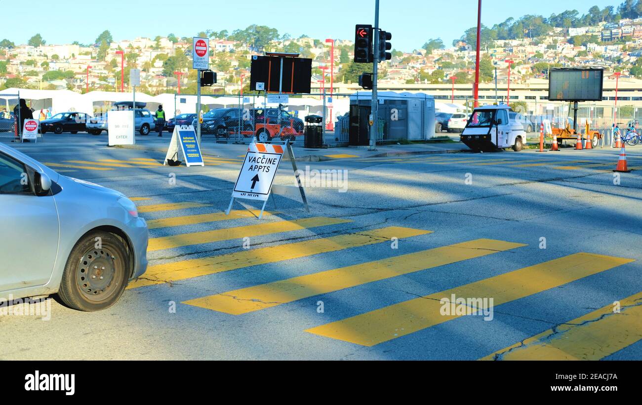 Traffic street sign directing patients to the Covid-19 vaccination site at City College of San Francisco, California; vaccine appointments only. Stock Photo