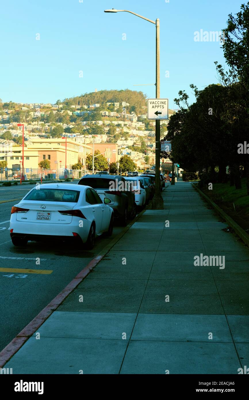 Traffic street sign directing patients to the Covid-19 vaccination site at City College of San Francisco, California; vaccine appointments only. Stock Photo